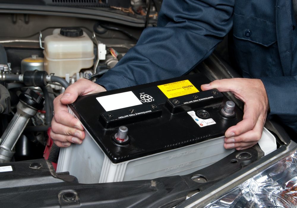 auto-mechanic-replacing-car-battery.jpg auto-mechanic-replacing-car-battery.jpg
